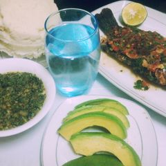 A picture of Fish with creamy kienyeji veges and ugali.