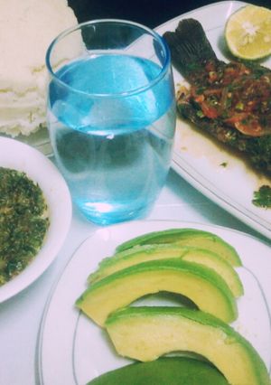A picture of Fish with creamy kienyeji veges and ugali.
