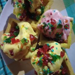 A picture of Tri colour butter scotch ice cream in conapse.