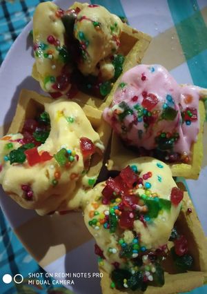 A picture of Tri colour butter scotch ice cream in conapse.