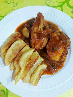 Una foto de Pollo en salsa reducida de sofrito con limón encurtido