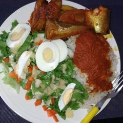 White rice with stew,Titus fish and salad A picture of White rice with stew,Titus fish and salad.