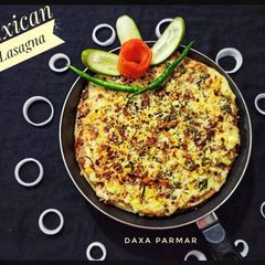 A picture of Mexican Lasagna / Enchiladas.