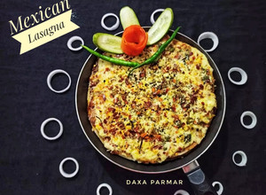 A picture of Mexican Lasagna / Enchiladas.