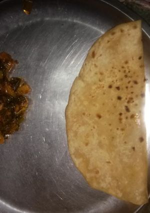 A picture of Green onion and potato sabji.