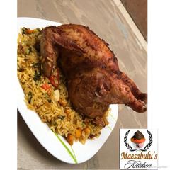 A picture of Whole chicken stuffed with rice.