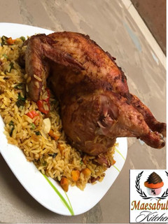 A picture of Whole chicken stuffed with rice.