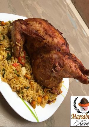 A picture of Whole chicken stuffed with rice.