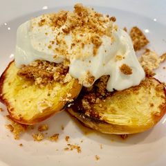 Baked Peaches with honey, amaretti and creme fraiche A picture of Baked Peaches with honey, amaretti and creme fraiche.