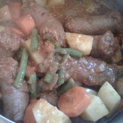 A picture of Wors in steamed veggies.