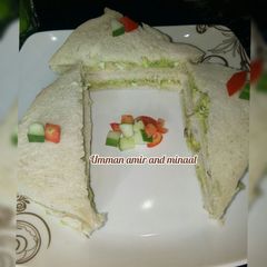 A picture of Avocado fish and egg sandwich.
