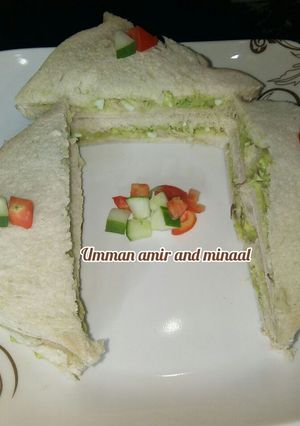 A picture of Avocado fish and egg sandwich.