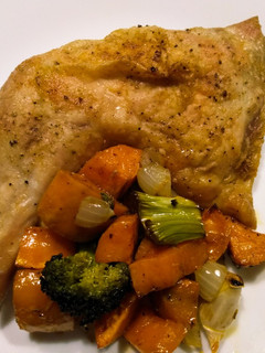A picture of Super-moist roast chicken with yams and broccoli.