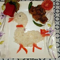 A picture of Aloo baigan ki sabzi with zeera rice.