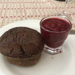 A picture of Chocolate fondants (lava cake) with raspberry coulis.