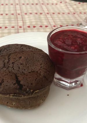 A picture of Chocolate fondants (lava cake) with raspberry coulis.