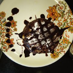 A picture of Chocolate pancake with fresh fruits.