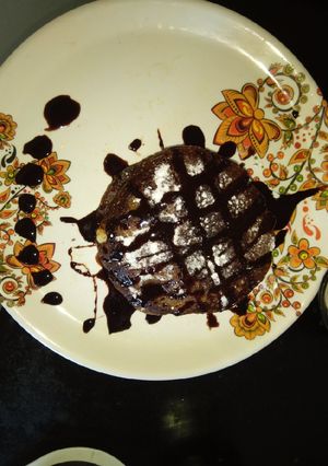A picture of Chocolate pancake with fresh fruits.