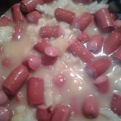 A picture of Hotdogs, pineapple, and cauliflower.