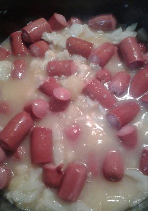 A picture of Hotdogs, pineapple, and cauliflower.