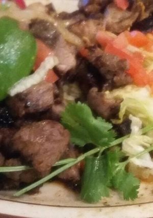 Una foto de Tacos de bistec y puerco a la parrilla