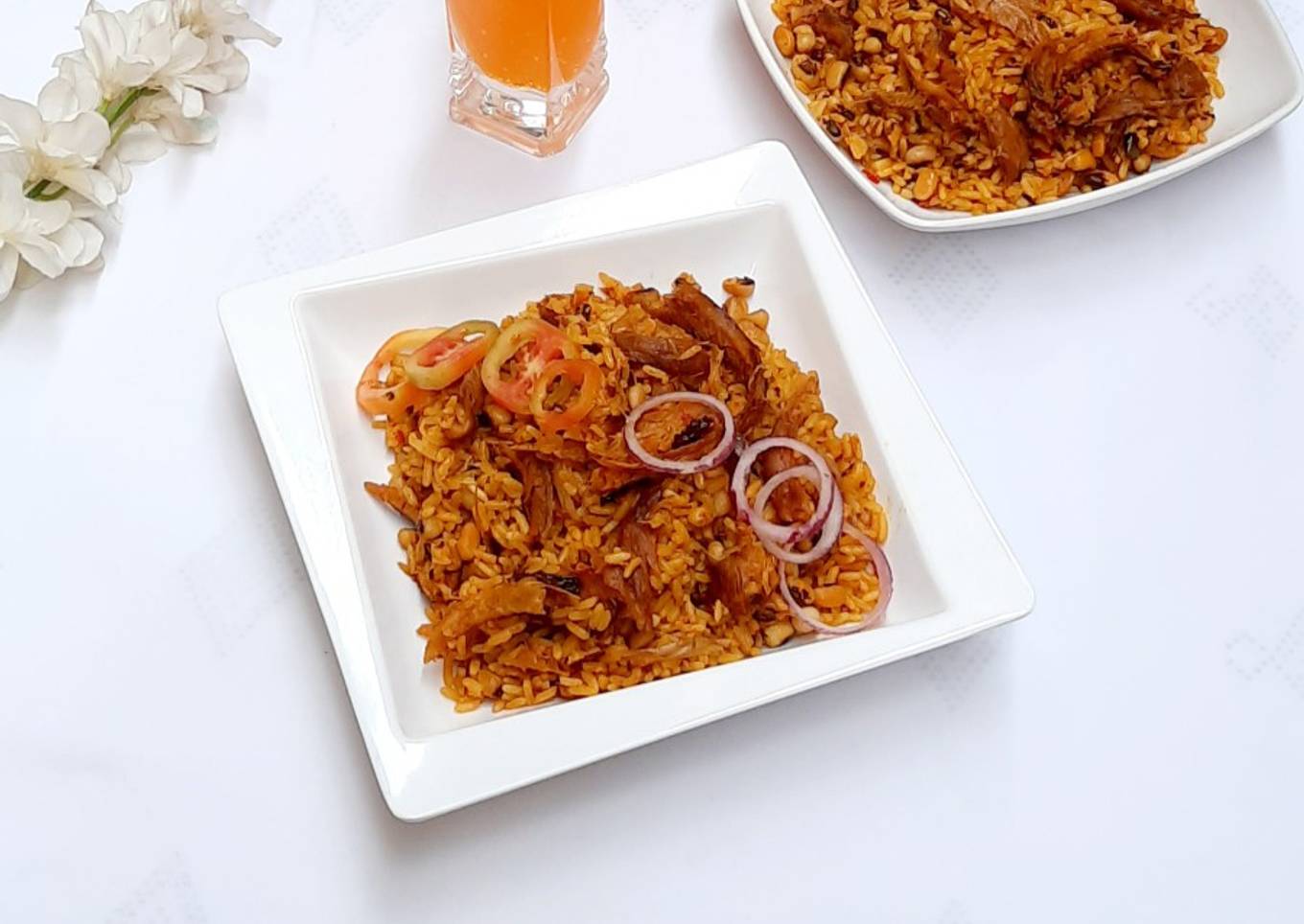 Palm oil jollof rice with dry fish