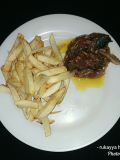 A picture of French fries &fish sauce.