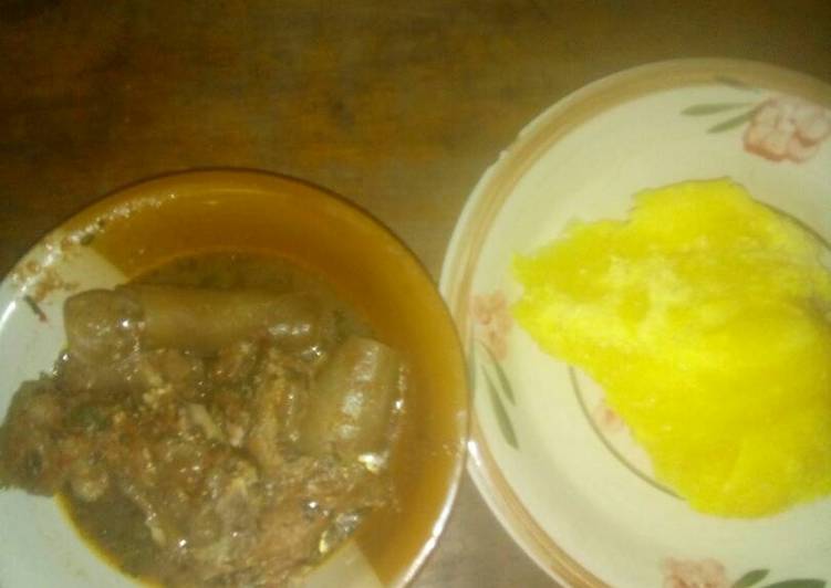 Okro soup with pomo and yellow garri