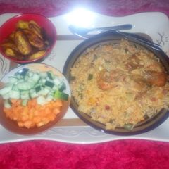 A picture of Jollof rice and chicken with plantain (Ramadhan recipe contest).