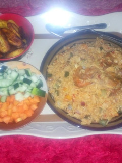 A picture of Jollof rice and chicken with plantain (Ramadhan recipe contest).