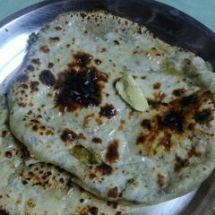 A picture of Stuff garlic naan # indian breads.
