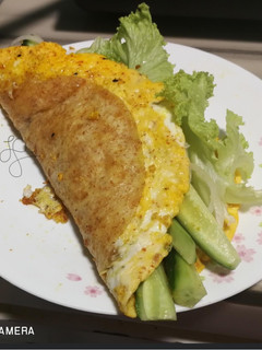 A picture of Tortilla Egg Wrap With Salad And Leftover Sambal Paste.