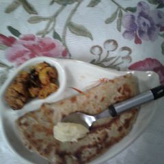 A picture of Garlic and herbs mixed butter spread Parantha.