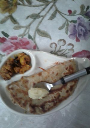 A picture of Garlic and herbs mixed butter spread Parantha.