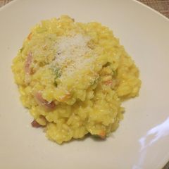 Saffron, zucchine (with flowers) and speck risotto A picture of Saffron, zucchine (with flowers) and speck risotto.