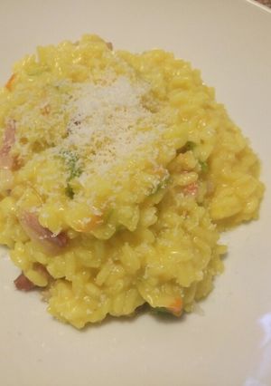 A picture of Saffron, zucchine (with flowers) and speck risotto.