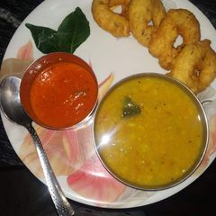 A picture of Medu vada with sambar.