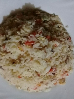 A picture of Fried Rice with scrabbled eggs.