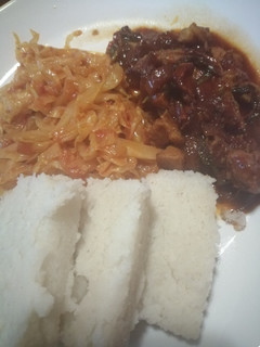 A picture of Ugali, cabbage and wet fry beef.
