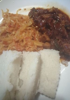 A picture of Ugali, cabbage and wet fry beef.