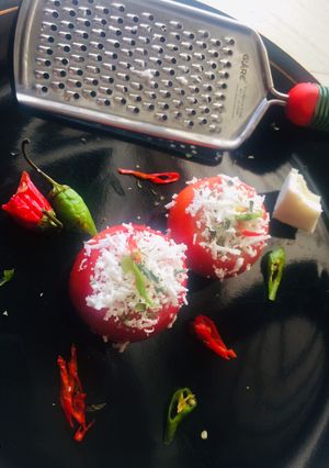 A picture of Pesto chesse baked Tomatoes.