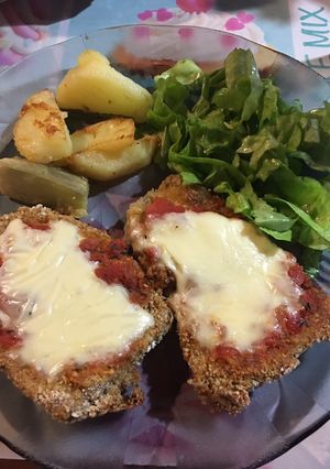Una foto de Milanesas de berenjena a la napolitana