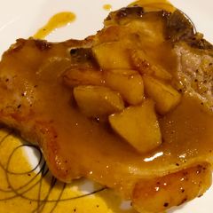 A picture of Pork chops with apple mustard sauce.