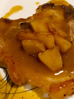 A picture of Pork chops with apple mustard sauce.