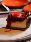 New York cheesecake w strawberry coulis & dark chocolate border