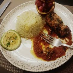 A picture of Curry rice with pepper sauce and grilled chicken.