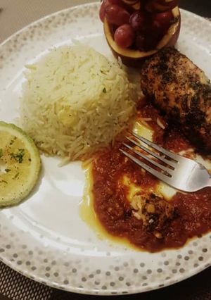 A picture of Curry rice with pepper sauce and grilled chicken.