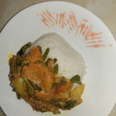 A picture of Rice with vegetables.