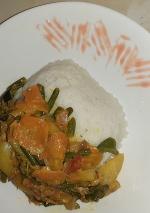 A picture of Rice with vegetables.