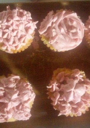 A picture of Vanilla cupcakes with butter cream.
